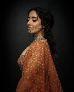 Jonita Gandhi Instagram - This is the beautiful @shyamalbhumika lehenga I wore for my new video 😍. Have you seen it yet? ‘It Is What It Is (Madhaniya)’ - official visualizer - is out now on my YouTube channel 🌺 Photos: @themediatronic Jewellery : @riddhi_bandra Styling Team : @gaurvivdesai & @nupur_p Asst : @Krishadedhia13 Hair team - @dwyessh_hairwizard @aaliyahussainhairmakeupcreator Makeup - @ankitamanwanimakeupandhair