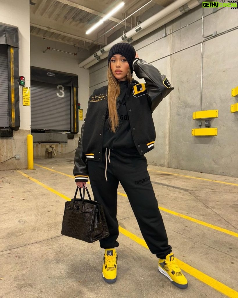 Jordyn Woods Instagram - A sample from the @woodsbyjordyn archive that @karltowns and I collaborated on.. I’m actually obsessed with this letterman.. should we produce this!? Also bringing something other than clothing to @woodsbyjordyn this holiday season.. 😉 ALSO Black Friday sale coming this week, 35% off and a free HAT with purchase over $150🤍