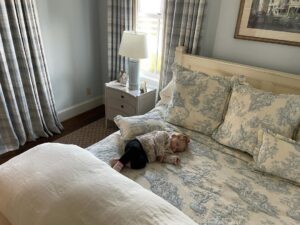 Josh Brolin Instagram - This is what parenting is. I hear the family upstairs having a Thanksgiving, and I am down here making sure my girl doesn’t fall off the edge of the bed when she wakes. She needs to sleep now and, like me, she’ll awake at the sounds of squealing kids pining to run for the small farm animals outside. She’s been sick, so every sleeping minute is another notch in her recovery. So I’ll sit and I’ll stare. I’ll gawk at how beautiful she is, or remember how just a moment ago she looked at me when dreams started to tickle at her in my arms: a last smile, that exhale coo, until finally she drifts off. I pretend that I’m here as security but know that there’s nowhere else I’d rather be than here watching you breathing in and breathing out, the red bow in your hair moving slightly with your breath, the cuffs of your sweater centered on the middle of your warm palms. There is nowhere else I’d rather be, my little angel, than here to experience you opening your eyes again, and smiling as if for the first time ever. ❤️🌹#chapelgrace