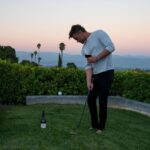 Josh Duhamel Instagram - Sipping @meiomiwines in one hand and chipping with the other. Sure it’s not pro-golfer status talent but it’s definitely the best way to watch golf from home. #MyMeiomi #MeiomiPartner For21+ #ad