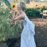Julianne Hough Instagram - A few of my favorite things… sunflowers and a beautiful @victoriabeckham dress 🌻💜 Sunflowers are some of the most magical flowers I’ve come across, which is why they’re my favorite. They always turn to face the sun and they’re known as a symbol for hope, healing and joy - something I always strive to have in my life and surround myself with. Even named my little one Sunny ☀️🐶