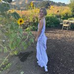 Julianne Hough Instagram - A few of my favorite things… sunflowers and a beautiful @victoriabeckham dress 🌻💜 Sunflowers are some of the most magical flowers I’ve come across, which is why they’re my favorite. They always turn to face the sun and they’re known as a symbol for hope, healing and joy - something I always strive to have in my life and surround myself with. Even named my little one Sunny ☀️🐶
