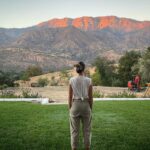 Justin Baldoni Instagram - When I catch her taking a moment to herself. Taking a moment to stop doing and start being. To ground herself, bare feet in the soil, humbling herself before the majesty of her mountains- I am reminded just how damn lucky I am to have found a woman willing to put everything aside and do the actual work. The quiet, painful, lonely, heart wrenching, deeply uncomfortable not fun- hard work of heart work. And in those moments when I witness her take a moment and pull the arrow back so she can fly forward. I feel myself healing because she is healing. And she is healing because I am healing. And when we lie in that field that is currently under construction just as we are. That field that exists not just outside our window but “out beyond ideas of right doing and wrongdoing … when our souls lie down in that grass and the world is too full to talk about” - I will thank God, our ancestors and anything or anyone else I can think of to thank that she was brought into my life. Just as I thank them now. So as I look at her taking this moment, I take my moment. And in this moment I realize that I need nothing else in this world except what she has already given me. Which is everything.