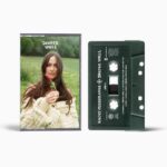 Kacey Musgraves Instagram – 𝐼’𝓋𝑒 𝒻𝑜𝓊𝓃𝒹 𝒶… deep love of sweater vests, tbh. 

Also – fun fact: the cassette is made out of recycled plastic.🐑 Album out March 15. Link in bio.