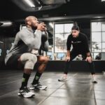 Kamaru Usman Instagram - 8+ years and we still working @drcpeacock 🤜🏿🤛🏻 #More2come