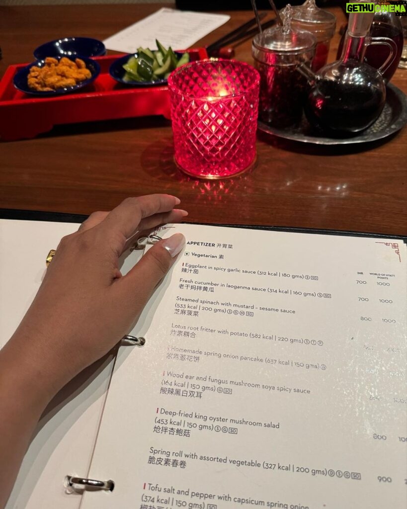 Karishma Sharma Instagram - The lady in red. ✨❤️ “Basking in the serene glow of the first full moon, I find my Zen zone, radiating happiness. 🌕 Reflecting on the delicious flavors of China by @grandhyattmumbai the stir-fried chicken paired with edamame created a healthy and delightful feast. Excited to explore more, the duck preparation awaits my eager taste buds. Cheers to manifesting positivity and savoring life’s delectable moments! 🍜❤️🤌🏼