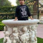 Kat Von D Instagram – Not that long ago, Leafar barely reached the top of this wishing well, and now he’s almost twice it’s height! 🙀 Not a day passes me where I don’t try and soak up every moment with my little one, but I gotta be honest, it’s going by way too damn fast! 🙀