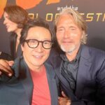 Ke Huy Quan Instagram - Indy will always be a hero to Short Round and Harrison Ford will always be a hero to me❣️ I wish he could continue in this role forever, but I was happy to be there last night to see him crack that whip one more time. Dial of Destiny is SO GOOD!!! Please go see it comes June 30th! (Can you spot another cast member from Temple of Doom? Hint: he loves voodoo dolls 😜) 📸: @gettyimages Styling: @chloekeiko Grooming: @sonialeeartistry Outfit: @paulsmithdesign Glasses: @cutlerandgross Watch: @omega Shoes: @churchs @indianajones @lucasfilm @disney