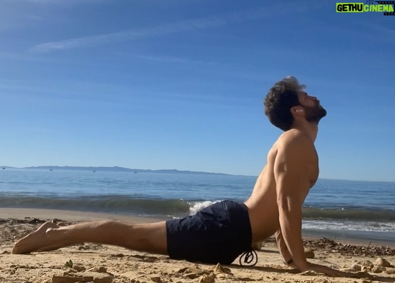 Keegan Allen Instagram - Did yoga on the beach for xmas and I videoed it for form check. (Swipe) A few days later, stumbled upon an old photo of my dad doing yoga on the beach! Same pose! Thatβs cool. A little π wave ππ» hello through a πͺ window of timelines