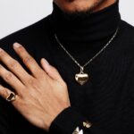 Keith Powers Instagram - Yo! I am honored and excited to be wearing the first #PradaFineJewelry collection, Eternal Gold with 100% recycled gold. Thank you @prada! #ad