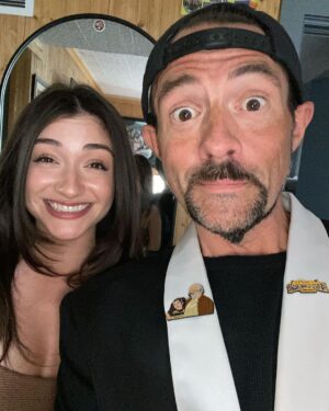 Kevin Smith Instagram - The Jersey Girl came to see JERSEY GIRL! @raquelxcastro paid a visit to my beloved @smodcastlecinemas to cap off a Memorial Day weekend full of shows! On Friday, we showed JAWS as part of the Movies That Made Me series. Then on Saturday night, we watched my flick RED STATE. But Sunday saw a reunion with the little girl who, at age 7, preternaturally played the role of Gertie in my sixth flick. We screened what we were calling JERSEY GIRL: The Snyder Cut, because it was the longest version of the flick ever edited, with an entire first act full of @jlo that got cut out due to post-Gigli hysteria. I haven’t seen any cut of JG since 2006, so it was a trip to see the movie I originally made #bennifer two decades ago. Hopefully, @paramountplus will want to stream it in 2024 for the 20th anniversary. It’s almost an entirely different flick. Also entirely different: Raquel, who’s now about 2 years younger than her cinematic Dad #benaffleck was when we shot it. I was happy to discover our troubled film didn’t ruin Rocky, who grew up to be such a wonderful kid with a great head on her shoulders. I can’t thank her enough for a killer kid performance, as well as for making the trip all the way from L.A. to be at #smodcastle with an ardent audience. It was a lovely weekend (with 3 profitable pre-show auctions, thank you bidders), during which I got to wear a trio of different jackets, as well as my new Smodcastle sneakers made by @1craftypunk! Next up: BABBLE-ON this Saturday and WATCH WITH KEV: @dctheflash on June 15, 16 & 17! Tickets available now at SmodcastleCinemas dot com! Take a trip to Smodcastle, where the movies come to play! #KevinSmith #smodcastlecinemas #raquelcastro #jersey #newjersey #film