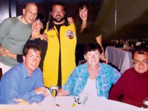 Kevin Smith Instagram - 20 years ago today, my Dad died. So this morning, my brother Don and I took our Mom to church. Shockingly, the roof didn’t cave in on the director of DOGMA. The mass was celebrated in memory of Pop - a man who shaped my life, both literally and figuratively before he left this world. Two decades back, my whole family happened to be in Philadelphia at the same time - so they all came to my #wizardworldphilly Q&A. After the Q&A, we went to dinner at @mortonssteak: @jenschwalbach, me, Dad, Donald, @donsgirlgrace, @virginia_in_vienna & her husband Eric (Don’s husband Jerry was stuck in Florida), where we had the time of our lives for the last time in his life. After a memorable meal with the family he co-created, Dad died in the wee hours of the following morning, June 1, 2003. A portion of his ashes have resided with me since his cremation, as a constant reminder of the quiet patriarch without whom I wouldn’t even exist. My sister has long maintained that I based Silent Bob on Dad - the guy who said very little unless he had something funny or insightful to impart (ironically, that would mean Jay is based on my Mom). I don’t know if I got Silent Bob from Dad, but I got nearly everything else. In the pic of me at the lectern, the bald spot in the front row is my Father - who fed me Standup comedy albums as a kid and loved to watch me talk to a crowd, knowing those records made an impact on his youngest son. While growing up, Dad took me to the movies all the time too - so he likely knew both  my careers as a storyteller came indirectly from his unintentional influence. I’m happy he got to meet @harleyquinnsmith (he was a big fan), but he’s been gone twenty years and I still miss him. So if you can (and if you wanna), hug your Dads for me today, Kids. And if you’re in Toronto on Friday or Jersey on Saturday, come see me at the @sandersoncentrebrantford or @smodcastlecinemas. That sounds like a self-serving plug because it is - but it’s also in memory of a guy who’d still be in the front row watching me if he could. Miss you, Pop. Rest in Power. #KevinSmith #dad #mementomori