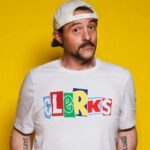 Kevin Smith Instagram – HAPPY CLERKS DAY!
30 years ago from today, CLERKS debuted at the 1994 Sundance Film Festival! That means, if you ever wanted to stop me or my career from happening, youʼd send a Terminator back to this moment in time 3 decades back.

Mercifully, there was no robotic hunter/killer trying to kill me at Sundance that year. The inaugural screening took place at the Holiday Village Cinema in a sold out 150 seater. That was the first time I got to see my first film with a full audience. The sheer thrill of finding out that ideas Iʼd had years prior actually held up to public scrutiny from strangers was intoxicating (but that also might have had something to do with the thin air at the high altitude). 

That first screening started the buzz that powered the next three screenings and a deluge of press about the black and white New Jersey convenience store movie and the director who was going back to work there after the Festival ended.

By our fourth and final Sundance screening at The Egyptian Theater on Main Street in Park City, Clerks was being talked about and written about like it was well worth watching. As he introduced me and the film, Festival head Geoff Gilmore described me in a way that still gets me in the feels when he said “If Kevin Smith didnʼt exist, the Sundance Film Festival wouldʼve had to invent him.”

Mine was a Cinderella-ish or Rocky-like tale that reminded folks anyone can take a shot at their dreams and maybe find a modicum of success – even if theyʼre from New Jersey.

Do you have a dream (one that doesnʼt involve hurting people or animals, destruction or death)?
2024 is the year you move closer to your goal and take your shot on yourself.

Many thanks to Brian, Jeff, Jay, Marilyn, Lisa, Scott, Dave, Kim, Virginia, Donald, Mom, Dad, the Thapars, and everyone else who helped me craft Clerks! Many thanks to Sundance, Mark Tusk, Bob Hawk and John Pierson for guiding a gobsmacked newcomer in his sudden success. And many thanks to you, my friends, for 30 years of continued interest in the Askewniverse adventures of retailing rascals 
Head over to JayAndSilentBob dot com TODAY to shop our anniversary sales!
#KevinSmith #clerks #film