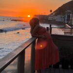 Khloë Terae Instagram - Counting down the hours 💕☀️🌊 @fashionnova wearing penelope maxi dress in coral size medium 🎀 Malibu, California