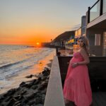 Khloë Terae Instagram - Counting down the hours 💕☀️🌊 @fashionnova wearing penelope maxi dress in coral size medium 🎀 Malibu, California