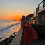 Khloë Terae Instagram - Counting down the hours 💕☀️🌊 @fashionnova wearing penelope maxi dress in coral size medium 🎀 Malibu, California