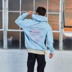 Kian Lawley Instagram - ‼️ HAPPY BLACK FRIDAY ‼️ my favorite hoodie just dropped & it’s my favorite color (baby blue) if yeux look closely at the back graphic yeux will see some 5 passport stamps from all around the world & they each have a date on them. all the dates are my families birthdays ;) click the link in my bio to get one to keep yeux warm for the holidays OR surprise ur friend and get one for them✨