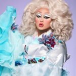 Kim Chi Instagram - This mug is brought to you by @kimchichicbeauty Rainbow Sharts Palette and my iconic HighKey Gloss. I used shades Blueberry in the crease and Ocean Blue in the corner of the eyes for a little highlight. To finish the look, I topped the lips off with my iconic HKG in shade Açaí. Photo: @sanchezzalba Dress: @souhui.official Hair: @wigsandgrace