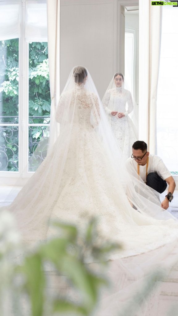 Kimberly Ann Voltemas Instagram - Accompany the luminous bride, Thai ambassador @Kimmy_Kimberley, for her final fitting as she joyfully slips into her one-of-a-kind, couture wedding gown designed by @MariaGraziaChiuri. The finishing touches are orchestrated by a team of expert seamstresses in the Dior Ateliers, to ensure a flawless fit that gracefully embraces her silhouette. Every inch is adorned in a dreamy flourish of opulent floral guipure in soft shades of ivory and beige, culminating in a play of light and transparency. The reveal is a tribute to bridal dreams and a testament to the excellence of #DiorSavoirFaire. © Photo: Sophie Carre