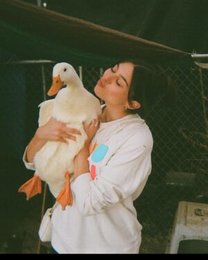 Kira Kosarin Instagram - got back in the supersuit(s), got engaged to my best friend, got to go to my first grammys, got to hold this duck. what else could you need? thanks 2023 💙⚡️💍🐤