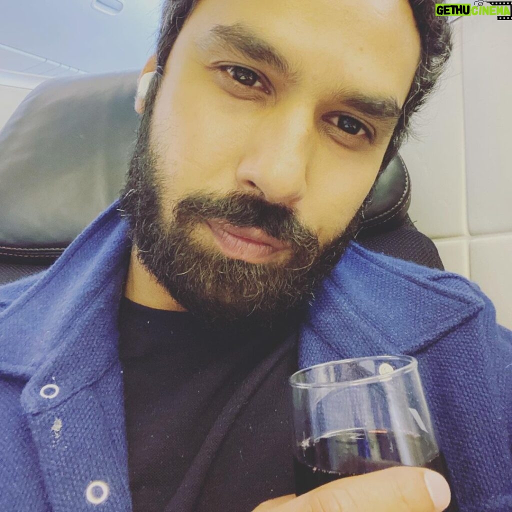 Kunal Nayyar Instagram - “Somewhere over the Atlantic.” A quick sip of wine without the mask;) and snuck a selfie… Prague here I come. Can’t wait to get going. Love. Love. Love. @netflix #Prague