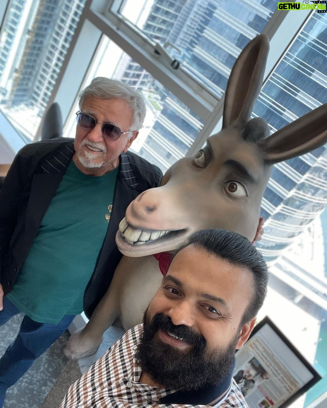 Kunchacko Boban Instagram - Meeting up with this legend is always a pleasure and an honour!! AHMAD GOLCHIN aka Golchin Bhai of Phars Films ,has seen it all and mastered it all. A businessman par excellence and a passionate Art-Lover…every time that I meet this man of the moment,there is much and more to learn from him. Thank you Pradeep for the warm arrangements done. And was happy to see the humorous side of Golchin bhai posing with his “Donkey Times” figurine🙃🙃 @golchin_pharsfilm #pharsfilms Legacy from 1954 onwards🤩…. Thank you Sir for all the support and cheers to many more greater movies together!!