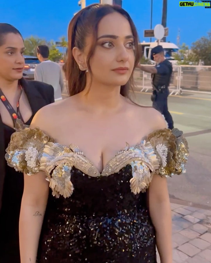 Kusha Kapila Instagram - my first red carpet and movie screening at #Cannes2023 ⭐️✨ @rahulmishra_7 dressed me for this starry moment in a custom off shoulder number. It had me at the neckline - golden poppy flowers and two goldfish kissing bang in the middle. Mermaid-like silhouette, Rahul went for old world glamour and I was here for it. @ayeshaaminnigam really outdid herself with this one. I am glad we share this moment, Ayesh 💜 thank you @rhiakapoor for kindly holding my trail and placing it so beautifully on the carpet. thank you @drsheths for making this moment happen🫶 Most of all, @fetch_india for making this dream come true. Styled by : @ayeshaaminnigam @rhiakapoor Assisted by: @sejal_satish.n @thanishqkokare Gown @rahulmishra_7 Jewels: @damianiofficial Shoes: @hausofhoneyclub Makeup : @aashna_shah Hair : @makeupbyvishakha Cannes, French Riviera, France
