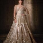 Kusha Kapila Instagram – 𝗜𝗻 𝗠𝘆 𝗧𝗧 𝗕𝗲𝘀𝘁

In what ways does your journey echo Tarun Tahiliani’s legacy?

“Through meticulously researched and thoughtfully crafted fits, Tarun Tahiliani’s vision beautifully complements the Indian woman’s form and my perspective on life resonates deeply with the ever-evolving nature of his collections—each distinct yet his own signature. Having previously worked as a fashion writer, covering his couture shows, it feels like life has come full circle as I now have the honour of representing his exceptional designs.”

Kusha Kapila is seen here in our gold lehenga that features Art Deco inspired artworks which are uplifted with Swarovski crystals, pearls and sequins. It is paired with an intricately-embellished corset and stylized drape.

Photography: @abhivermaa 
Makeup: @leeview_makeup 
Styling: @louw.77
Muse: @kushakapila 
Sets: @studio2.one @vivek.negi.14 
Carpet: @obeetee 
Decor: @kalikaar_design 
Jewellery: #TTTIJORI 
Location: @arayabagh

#TarunTahiliani #InMyTTBest