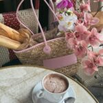 Léna Mahfouf Instagram – la Mère de Paris est de retour dans ses quartiers. J’ai déjà mes looks printaniers @claudiepierlot et mes petits paniers, la moindre des choses aurait été de m’accueillir avec le soleil. 🥐🎀 

collaboration commerciale 
photographie retouchée Paris, France