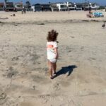 Lala Kent Instagram - A little “Ocean goes to Newport” carousel. Made my heart so full watching O play where I used to play at her age. Newport holds a special place in my heart. My dad would have us set up on this beach at 7 am & we’d stay until the sun went down. Ocean is making him proud. A beach bum just like her Poppy 🌊