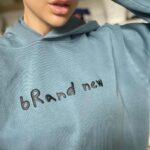 Lala Kent Instagram - Your new hoodies are ready. Let me break it down for you. I had a name tattooed on my arm, and changed it to brand new. The point of that was to take the power away from something and give it new power. I didn’t need to cover it completely. It was never powerful enough to do that. But the new me is powerful enough to take away any significance in that name. Brand new, baby. ShopLalaKent.com