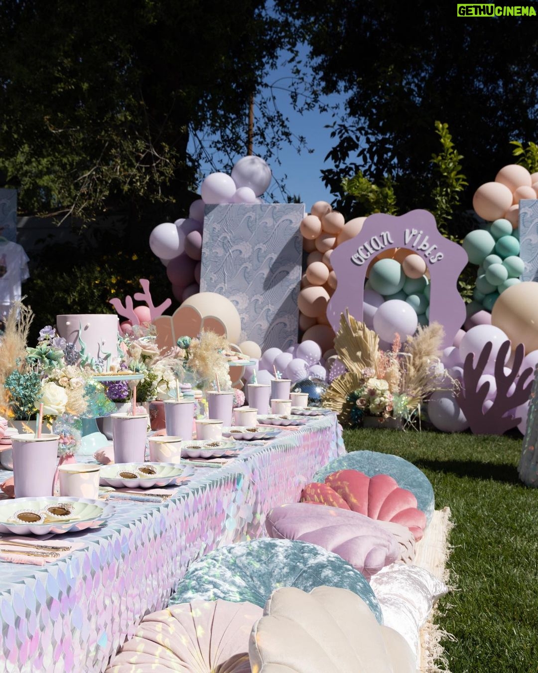 Lala Kent Instagram - I’m still dying over Ocean’s birthday party. I’ve gotten A LOT of messages asking about everything. So here are some pictures and you can find the contacts below 🤍🌊🥳 Photography: @jessicaczarneckicreative Party planners: @picnic_and_petal @glitzandgather Table setting + styling: @picnic_and_petal Balloon installation + styling: @glitzandgather Florist: @lovestruckblooms Acrylic goods: @atomickraftworks Graphic design: @winkandinkpaperie Custom backdrops: @trudesign.contracting Party supplies: @paperandparties Custom party hats + wands: @winnieandhaze Table linens: @cvlinens Custom neon sign: @sketchandetch.neon Cake: @thegateauxshoppe_ Custom macarons + macaron tower: @boymama_bakes Custom sugar cookies: @megans.bakes Candy tray and personalized pouches: @madesweet_byamanda Soft play: @modernkidsplaycompany Mini bounce house: @minicastlesco Custom shirts: @freshbakedteesprintshop Custom bathing suits + trucker hats: @sunnyboutiquemiami Custom Visors + cups: @bubblyandbash Custom sunglasses: @estherbrophoenix Custom air fresheners: @dangle_it Custom can coolers: @carolinacancoolers Custom tissue paper + stickers: @coacousa Custom crayons: @thecrayonclique Custom coloring books: @munchkinlanellc Seashell towels: @shopthemagicbox Coolers: @revocoolers Sparkling water: @sanpellegrino_us @perrierusa Wine: @avaline Venue: @mrjaxtaylor @brittany @littlebabycauchi house