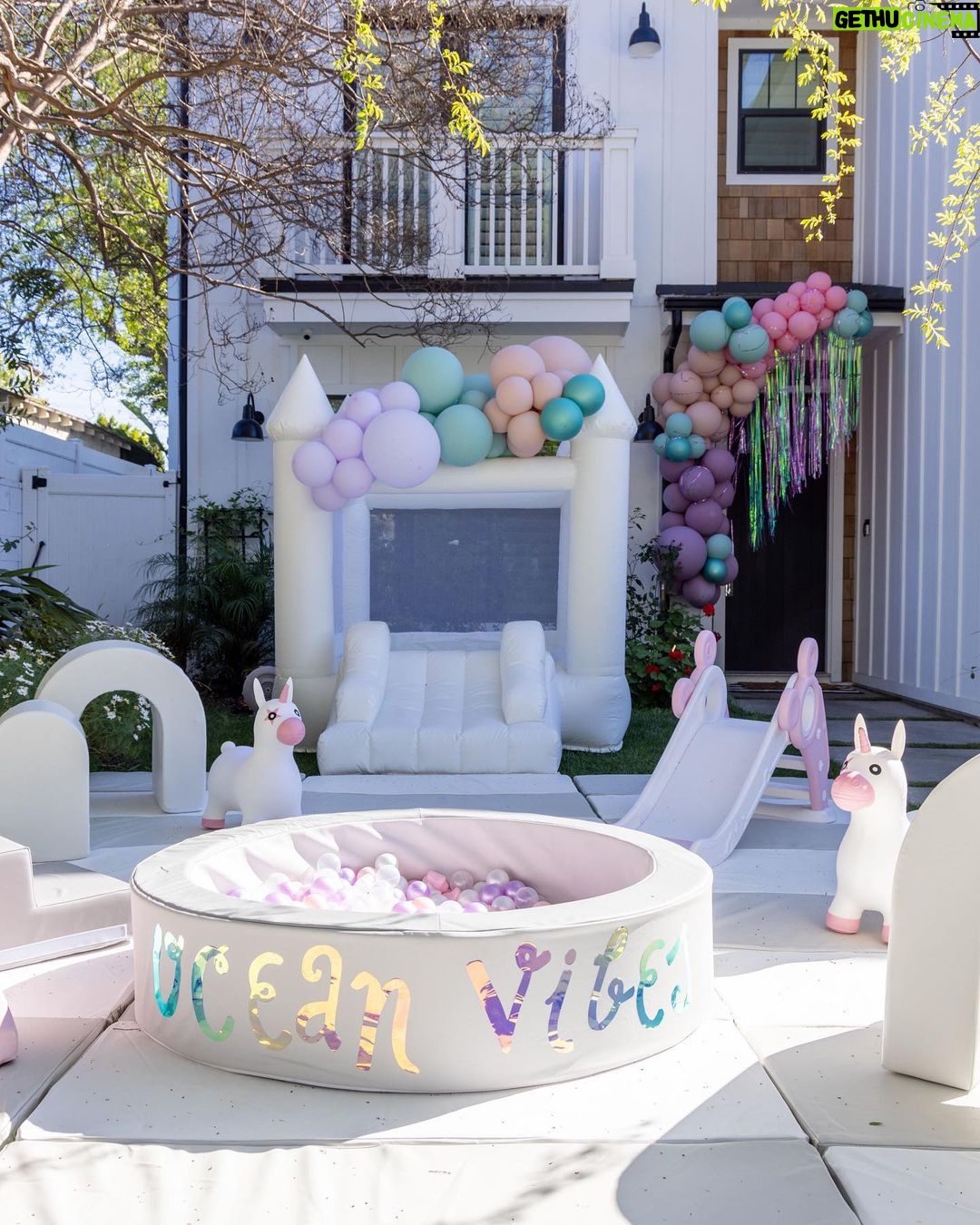 Lala Kent Instagram - I’m still dying over Ocean’s birthday party. I’ve gotten A LOT of messages asking about everything. So here are some pictures and you can find the contacts below 🤍🌊🥳 Photography: @jessicaczarneckicreative Party planners: @picnic_and_petal @glitzandgather Table setting + styling: @picnic_and_petal Balloon installation + styling: @glitzandgather Florist: @lovestruckblooms Acrylic goods: @atomickraftworks Graphic design: @winkandinkpaperie Custom backdrops: @trudesign.contracting Party supplies: @paperandparties Custom party hats + wands: @winnieandhaze Table linens: @cvlinens Custom neon sign: @sketchandetch.neon Cake: @thegateauxshoppe_ Custom macarons + macaron tower: @boymama_bakes Custom sugar cookies: @megans.bakes Candy tray and personalized pouches: @madesweet_byamanda Soft play: @modernkidsplaycompany Mini bounce house: @minicastlesco Custom shirts: @freshbakedteesprintshop Custom bathing suits + trucker hats: @sunnyboutiquemiami Custom Visors + cups: @bubblyandbash Custom sunglasses: @estherbrophoenix Custom air fresheners: @dangle_it Custom can coolers: @carolinacancoolers Custom tissue paper + stickers: @coacousa Custom crayons: @thecrayonclique Custom coloring books: @munchkinlanellc Seashell towels: @shopthemagicbox Coolers: @revocoolers Sparkling water: @sanpellegrino_us @perrierusa Wine: @avaline Venue: @mrjaxtaylor @brittany @littlebabycauchi house
