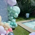 Lala Kent Instagram - I’m still dying over Ocean’s birthday party. I’ve gotten A LOT of messages asking about everything. So here are some pictures and you can find the contacts below 🤍🌊🥳 Photography: @jessicaczarneckicreative Party planners: @picnic_and_petal @glitzandgather Table setting + styling: @picnic_and_petal Balloon installation + styling: @glitzandgather Florist: @lovestruckblooms Acrylic goods: @atomickraftworks Graphic design: @winkandinkpaperie Custom backdrops: @trudesign.contracting Party supplies: @paperandparties Custom party hats + wands: @winnieandhaze Table linens: @cvlinens Custom neon sign: @sketchandetch.neon Cake: @thegateauxshoppe_ Custom macarons + macaron tower: @boymama_bakes Custom sugar cookies: @megans.bakes Candy tray and personalized pouches: @madesweet_byamanda Soft play: @modernkidsplaycompany Mini bounce house: @minicastlesco Custom shirts: @freshbakedteesprintshop Custom bathing suits + trucker hats: @sunnyboutiquemiami Custom Visors + cups: @bubblyandbash Custom sunglasses: @estherbrophoenix Custom air fresheners: @dangle_it Custom can coolers: @carolinacancoolers Custom tissue paper + stickers: @coacousa Custom crayons: @thecrayonclique Custom coloring books: @munchkinlanellc Seashell towels: @shopthemagicbox Coolers: @revocoolers Sparkling water: @sanpellegrino_us @perrierusa Wine: @avaline Venue: @mrjaxtaylor @brittany @littlebabycauchi house