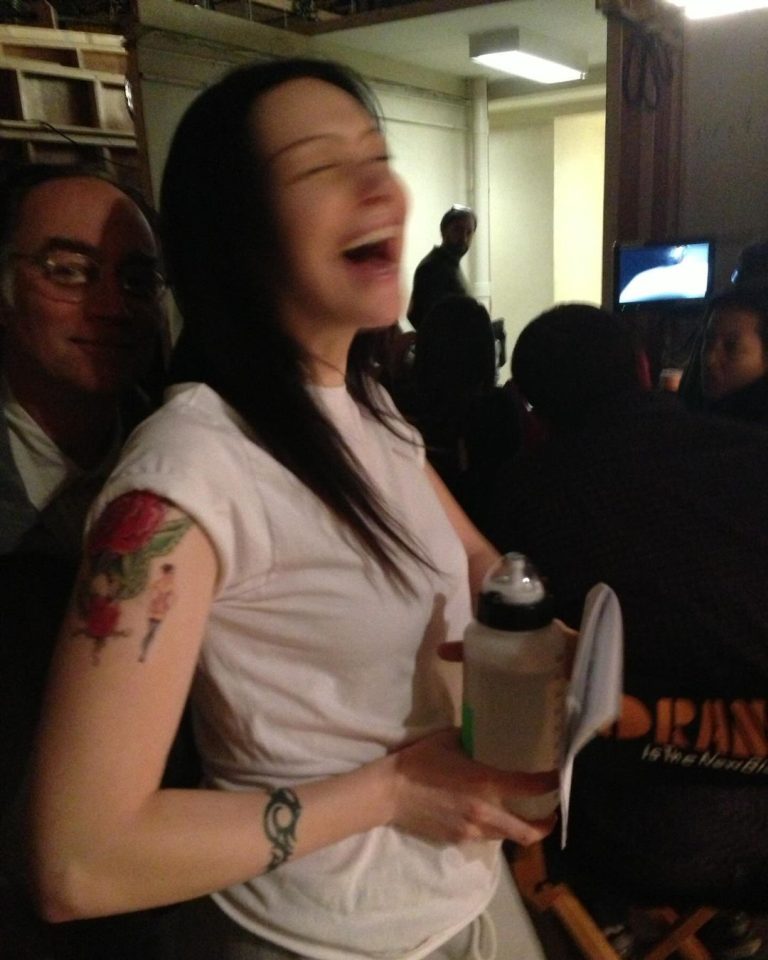 Laura Prepon Instagram - My expression from behind the scenes at #OITNB says it all — very grateful we can get back to work! #sagaftrastrong #throwback #tbt