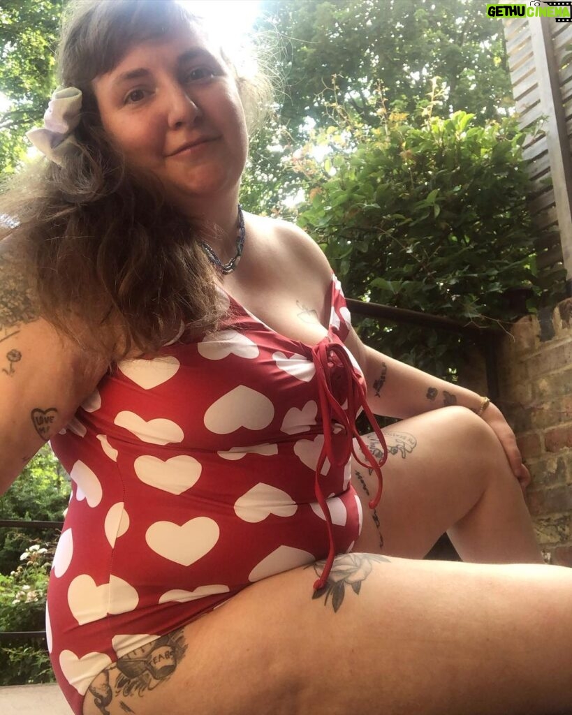 Lena Dunham Instagram - This is a moment of gratitude- not for the sun (although it sure is sweet after all this London rain, and I thought rain was my thing...) And not for this new bathing suit (although it’s pretty exciting when something is both covered in hearts AND accommodates the ample belly.) No, this is gratitude for YOU. It’s easy to go down the rabbit hole, yelling about how the internet is mean and false and destroying our social fabric yadda yadda yadda, but this community, right here on the ‘gram, has been so consistently loving, kind and connected for such a long time. You’ve generously allowed me to share my tougher moments and my most sweet ones too and, most essentially for me since it is why I am haunting the planet like a ghost who can’t read the room, my art. The fact that you’ve shown me love when I am, in fact, a stranger is a testament to the goodliness of human nature. So this is just a note to say thank you, I’m with you and - to quote my love @taylour- remember to put your feet in the grass. I just did and it helped, with everything. Then I saw a slug and came back on the deck but you know, points for trying? I’m giving you all points for trying this Monday. ❤️☀️ Attitude of Gratitude