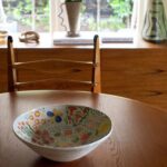 Lesley-Ann Brandt Instagram - One of my most precious pieces. Kingston’s class art bowl, hand painted by his class with each kiddo getting a section to do. I left so many of my childhood things behind when we immigrated from South Africa to New Zealand. I cherish the little things. 🌸🤴🏽🌼