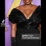 Leslie Jones Instagram - Once again my team made me look flawless!! (That’s a joint not cig🫠) Stylist: @brianmcphatter MUA: @lolasbeautymark Hair: @shaluga111 📸: @evision_photoz Dress: @jovanalouis x @thekevinmayes Earrings: @vraiofficial x Shoe: @stuartweitzman x Clutch @tylerellisofficial