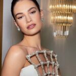 Lily James Instagram - @bafta 🎥 🖤 @rebeccacorbinmurray @halleybrisker @sofiatilbury @charlottetilbury @michelleclassnails it doesn’t work without you. Cheerleader magician artists 🤍 @sadaf_jaffari facials have literally transformed my skin 💫 @bulgari @onlynaturaldiamonds @tamararalph xxx