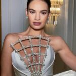 Lily James Instagram - @bafta 🎥 🖤 @rebeccacorbinmurray @halleybrisker @sofiatilbury @charlottetilbury @michelleclassnails it doesn’t work without you. Cheerleader magician artists 🤍 @sadaf_jaffari facials have literally transformed my skin 💫 @bulgari @onlynaturaldiamonds @tamararalph xxx
