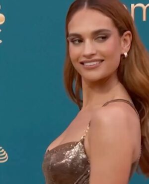 Lily James Instagram - @donatella_versace this dress is out of this world. I love every tiny detail. Golden chain mail at the Emmys 🙏 Thank you so much. I will never ever forget it, love you! And thank you to everyone who poured their talent and skill into making this sensational dress. A dream. @versace forever 🤎🤎🤎