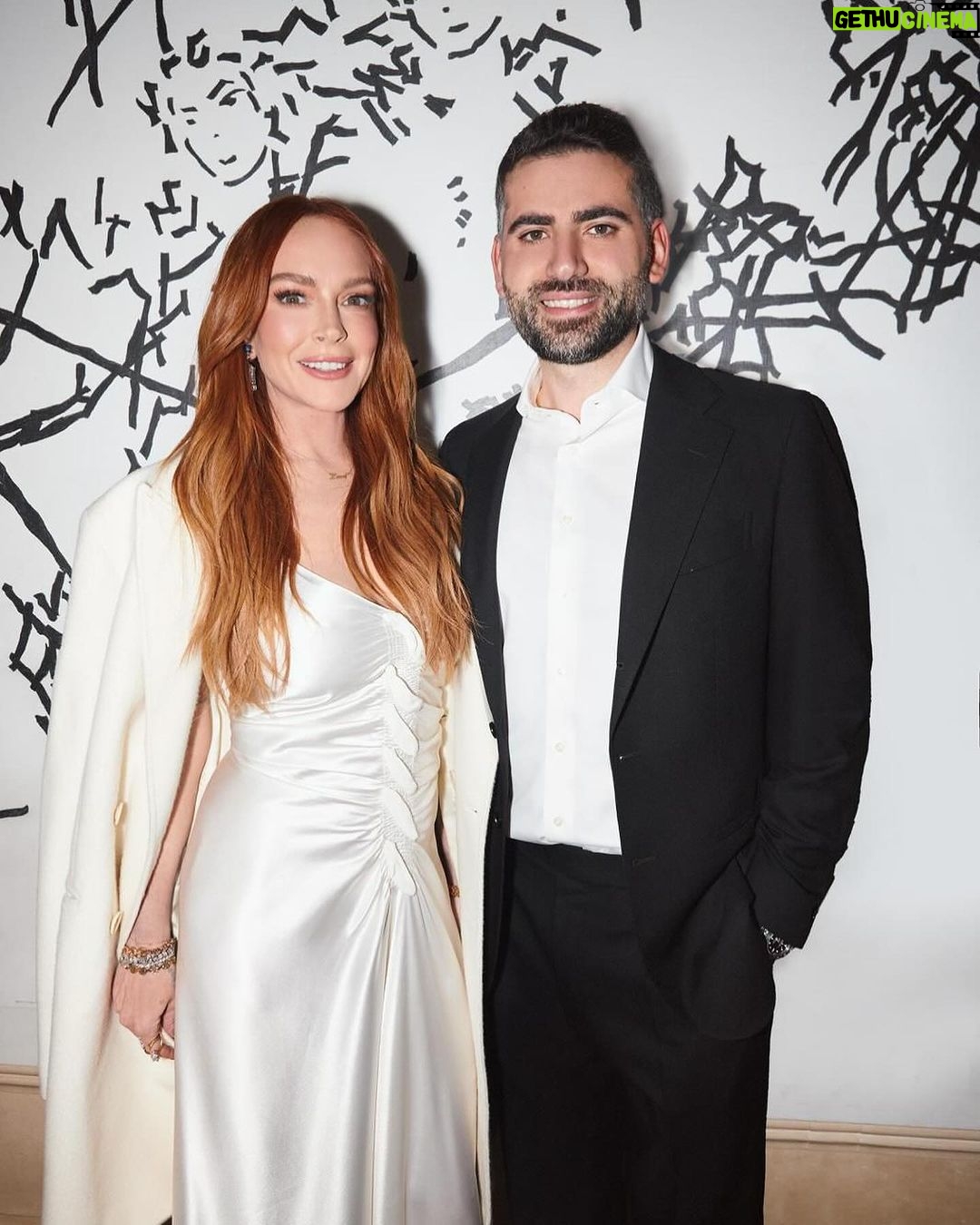 Lindsay Lohan Instagram - So grateful for all of the love and support ☘️🥰 Makeup: @kristopherbuckle Hair: @daniellepriano Styling: @marielhaenn #randm @robzangardi Nails: @enamelle Photography: @iam_newyorkmade Dress: Archive @jgalliano Shoes: @casadeiofficial Coat: @sentaler Earrings: @worldofreza Bag: @huntingseasonnyc Bracelets: @hoorsenbuhs @vraiofficial #netflix #netflixfilm #irishwish