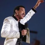 Lionel Richie Instagram - The little details about the big picture…✨ Custom designed satin tailcoat by @davethomasstyle with black @swarovski hand beading on collar and cuffs and an explosion of crystals cascading from the shoulders. - Thanks Dave 🤩