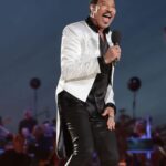 Lionel Richie Instagram - The little details about the big picture…✨ Custom designed satin tailcoat by @davethomasstyle with black @swarovski hand beading on collar and cuffs and an explosion of crystals cascading from the shoulders. - Thanks Dave 🤩