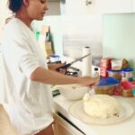 Lisa Haydon Instagram – Swipe 👉 for how we feel about staying home.. don’t mind my poor carribean accent @shabin67 and yes I’ve become a baker… 10 wks now. pasting the recipe below 😋 #stayathome
Red Velvet Cake
3 cups flour
1 teaspoon baking soda
2 Tablespoons unsweetened natural cocoa powder
1/2 teaspoon salt
1/2 cup butter, softened to room temperature
2 cups castor sugar
1 cup vegetable oil (not olive)
4 large eggs, separated
1 Tablespoon vanilla extract
1 teaspoon white vinegar
liquid or gel red food coloring
1 cup buttermilk
Cream Cheese Frosting
400 grams cream cheese
1/2 cup butter, at room temperature
3 cups icing sugar
1 Tablespoon cream or milk
1 and 1/2 teaspoons pure vanilla extract
Instructions
Preheat oven to 350°F (177°C). Grease two 8 inch cake pans. I only had one pan .. so I baked the cakes one at a time.
Make the cake: Whisk the flour, baking soda, cocoa powder, and salt together in a large bowl. Put aside.
With a handheld mixer or whisk, beat the butter and sugar together on medium-high speed until combined. Add in the oil, egg yolks, vanilla extract, and vinegar and beat on high for 2 minutes. (Set the egg whites aside.)
Add the dry ingredients in 2-3 parts alternating with the buttermilk. Add in the food colouring (however red you like) until combined (today I had none, fret not, this doesn’t change the cake taste. Whisk the 4 egg whites till foamy/firm. fold into cake batter.
Divide batter between 2 cake pans. I only had one pan so I baked them one at a time. Bake for 30-40 mins. careful not to overbake as the cakes may dry out. Remove cakes from the oven and cool. The cakes must cool before frosting. Blend all frost ingredients together. Then slice the tops of the cakes off to make them flat. Frost cake one. Stack the 2nd and frost also. Refrigerate for 1hr & enjoyyy 🐷. This cake tastes even better a day later.