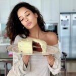Lisa Haydon Instagram – Swipe 👉 for how we feel about staying home.. don’t mind my poor carribean accent @shabin67 and yes I’ve become a baker… 10 wks now. pasting the recipe below 😋 #stayathome
Red Velvet Cake
3 cups flour
1 teaspoon baking soda
2 Tablespoons unsweetened natural cocoa powder
1/2 teaspoon salt
1/2 cup butter, softened to room temperature
2 cups castor sugar
1 cup vegetable oil (not olive)
4 large eggs, separated
1 Tablespoon vanilla extract
1 teaspoon white vinegar
liquid or gel red food coloring
1 cup buttermilk
Cream Cheese Frosting
400 grams cream cheese
1/2 cup butter, at room temperature
3 cups icing sugar
1 Tablespoon cream or milk
1 and 1/2 teaspoons pure vanilla extract
Instructions
Preheat oven to 350°F (177°C). Grease two 8 inch cake pans. I only had one pan .. so I baked the cakes one at a time.
Make the cake: Whisk the flour, baking soda, cocoa powder, and salt together in a large bowl. Put aside.
With a handheld mixer or whisk, beat the butter and sugar together on medium-high speed until combined. Add in the oil, egg yolks, vanilla extract, and vinegar and beat on high for 2 minutes. (Set the egg whites aside.)
Add the dry ingredients in 2-3 parts alternating with the buttermilk. Add in the food colouring (however red you like) until combined (today I had none, fret not, this doesn’t change the cake taste. Whisk the 4 egg whites till foamy/firm. fold into cake batter.
Divide batter between 2 cake pans. I only had one pan so I baked them one at a time. Bake for 30-40 mins. careful not to overbake as the cakes may dry out. Remove cakes from the oven and cool. The cakes must cool before frosting. Blend all frost ingredients together. Then slice the tops of the cakes off to make them flat. Frost cake one. Stack the 2nd and frost also. Refrigerate for 1hr & enjoyyy 🐷. This cake tastes even better a day later.