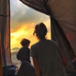 Lisa Haydon Instagram - Very proud of how we pulled off this weekends camping trip. Spending 4 hours in the equipment store figuring out the right tent for a family, testing the lightest mattresses to carry with most sleeping comfort- efforts aside, our comfort level was extremely low😂. Camping on the beach looks a lot better than it feels. Yet, struggling to keep our fire going in extreme wind, trying to explain to our son that this is our whole house for now, and we must not throw sand in it as we have to sleep in it, being attacked by wild boars, plus carrying the weight of our children up and down a mountain- all feels surreal. And as our only toilet paper roll flapped in the wind hanging from a piece of metal off our make-shift stove I reminded myself that “Simplicity is the ultimate Sophistication”. Of course no one needed reminding come sunrise 🌅