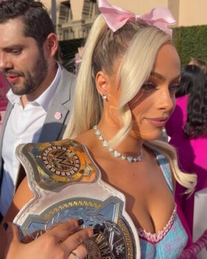 Gionna Daddio Instagram - This Barbie is a WWE Champion ✨💞

Thank you for having me @wbpictures @mattel 🖤🙏 

& Thank you to the very best glam squad a Barbie could ask for 🥹 

Styled by: @kingtroi 
Hair: @hayleyheckmann 
Makeup: @erosmua 
Tan: @isabelalysa