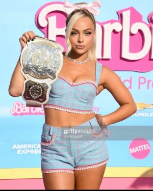 Gionna Daddio Instagram - This Barbie is a WWE Champion ✨💞

Thank you for having me @wbpictures @mattel 🖤🙏 

& Thank you to the very best glam squad a Barbie could ask for 🥹 

Styled by: @kingtroi 
Hair: @hayleyheckmann 
Makeup: @erosmua 
Tan: @isabelalysa