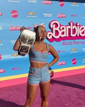 Gionna Daddio Instagram - This Barbie is a WWE Champion ✨💞

Thank you for having me @wbpictures @mattel 🖤🙏 

& Thank you to the very best glam squad a Barbie could ask for 🥹 

Styled by: @kingtroi 
Hair: @hayleyheckmann 
Makeup: @erosmua 
Tan: @isabelalysa